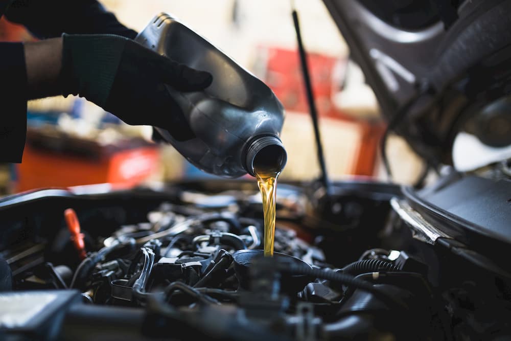 Vehicle maintenance adding oil
